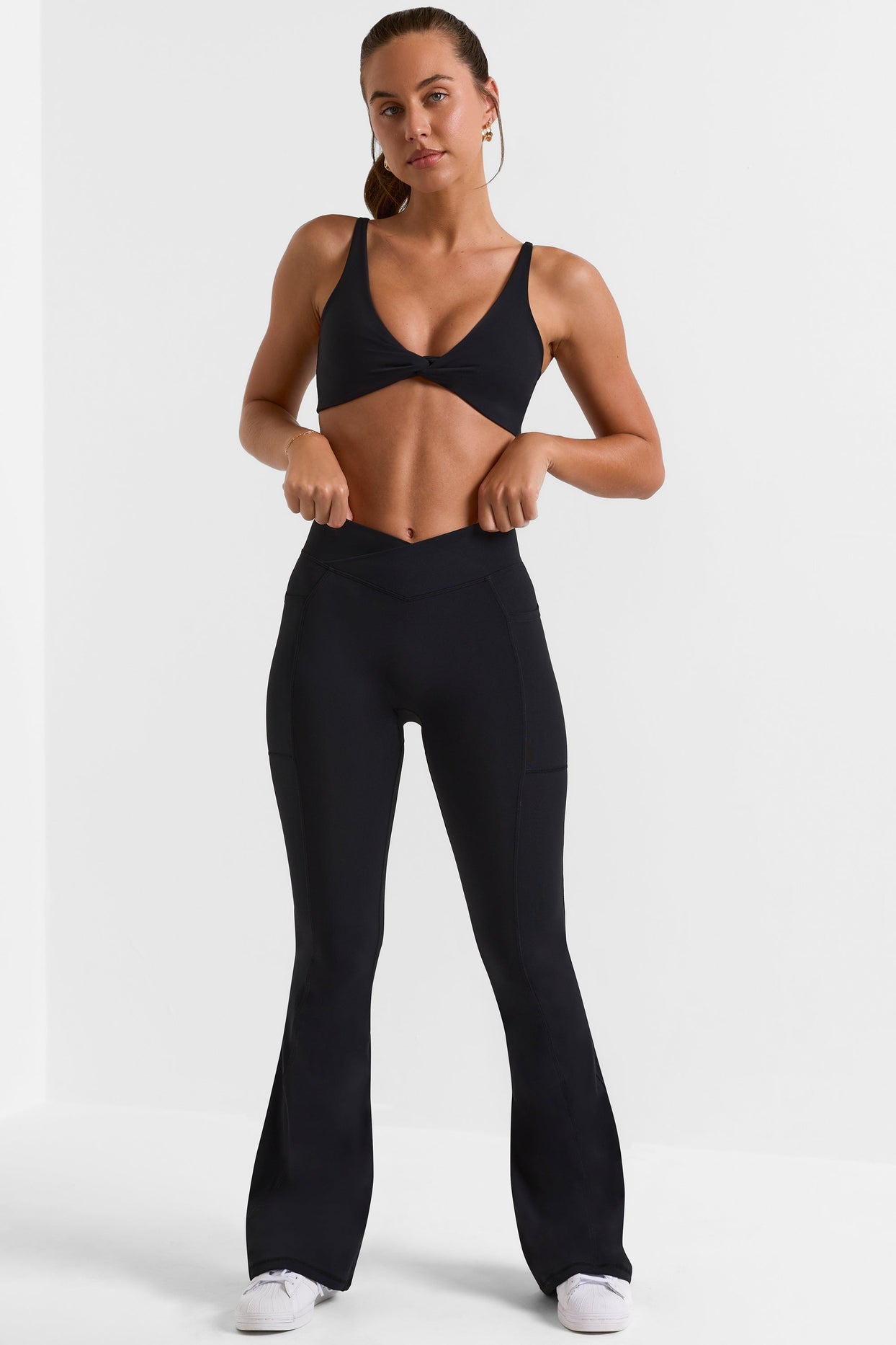 Petite Cross Waistband Flare Pocket Leggings in Black