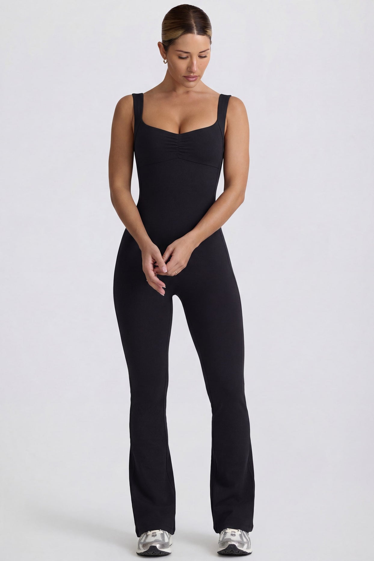 Bo+Tee's Hayley wearing the WithLovePerfectMatch Regular Jumpsuit in Black Soft Active (Cut & Sew) fabric perfect for yoga sessions