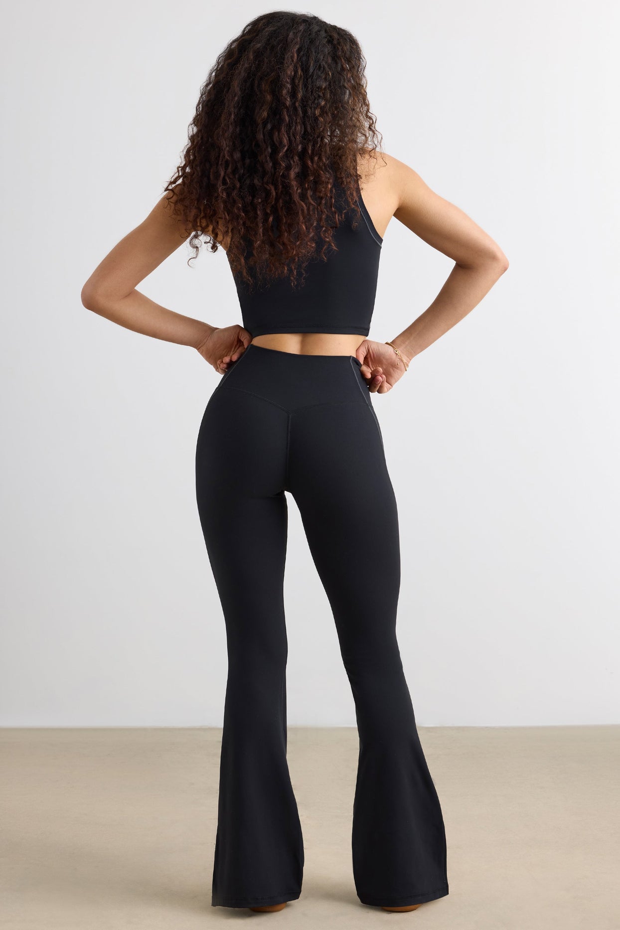Soft Active Petite Flared Trousers in Black Oh Polly