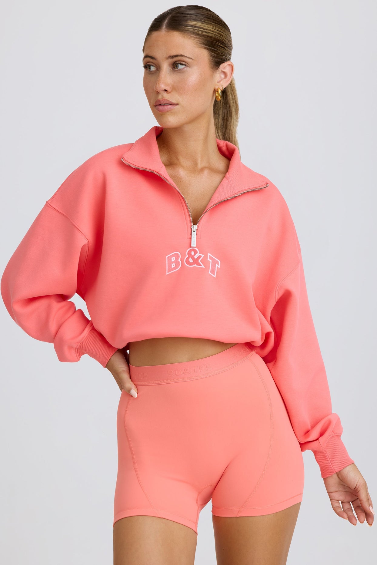 Quarter-Zip Cropped Sweatshirt in Coral