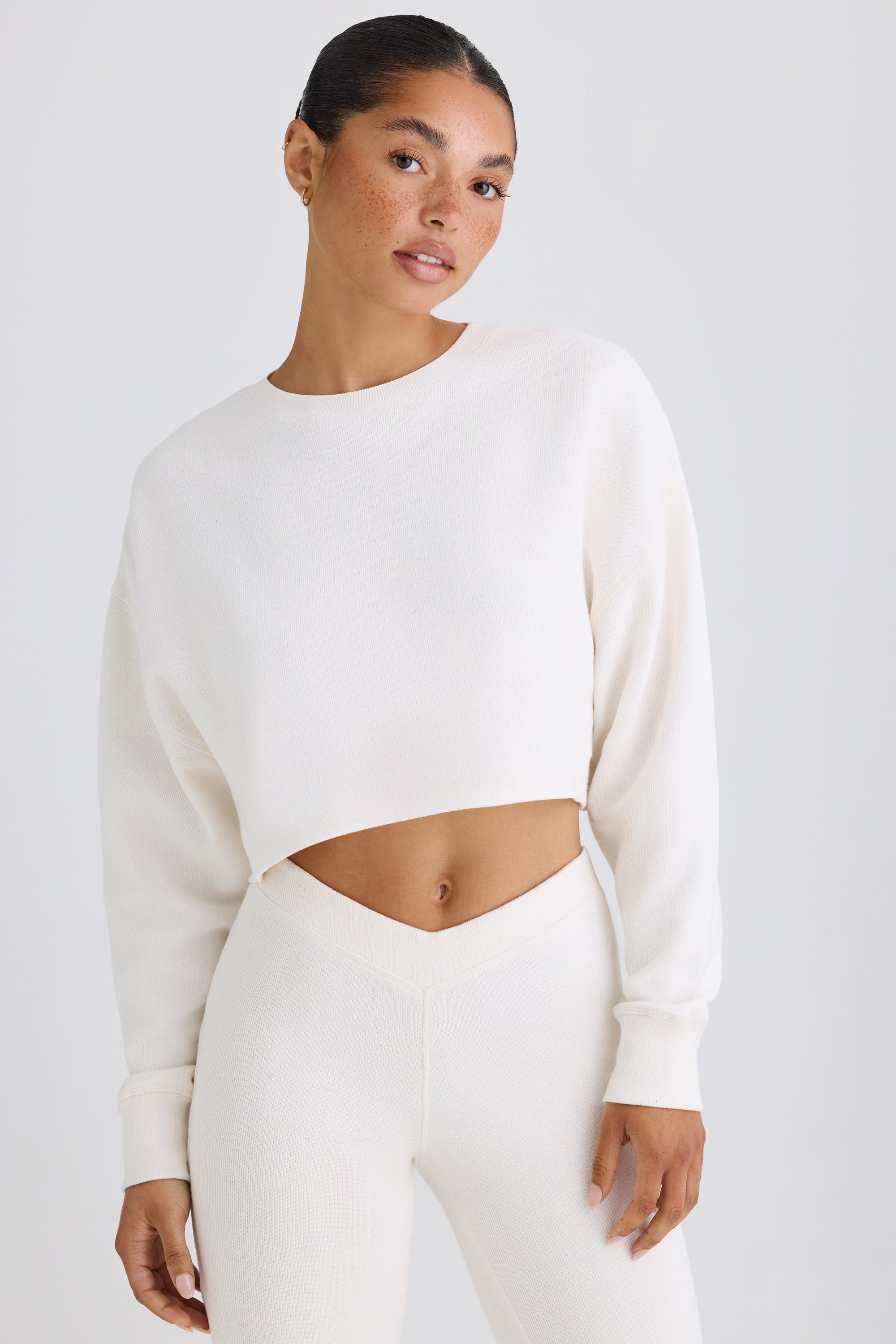 Jet Set Crew Neck Open Back Cropped Sweatshirt in White Oh Polly