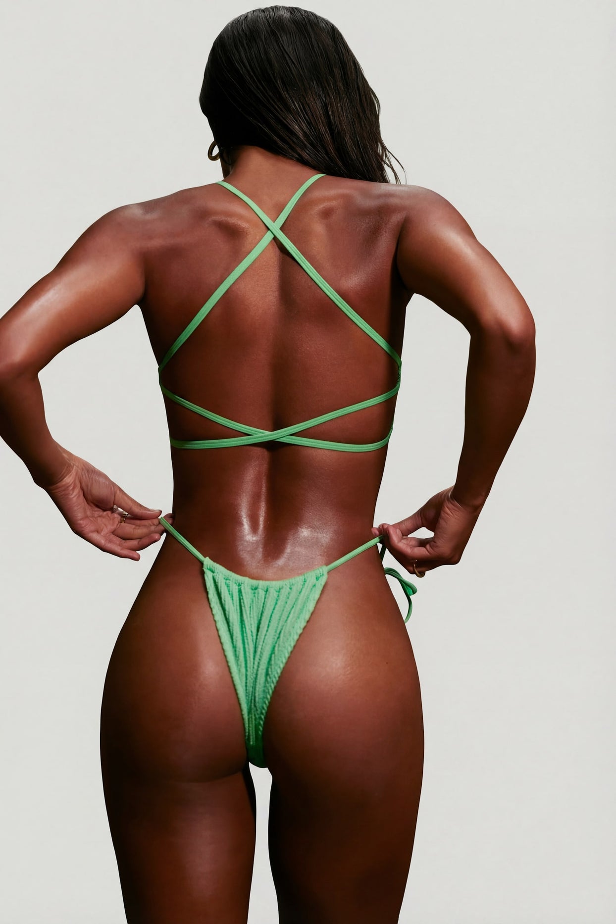 Oh Polly Swim's Kiele wearing the Seersucker Bikini Top in Seafoam Green fabric perfect for beach vacations