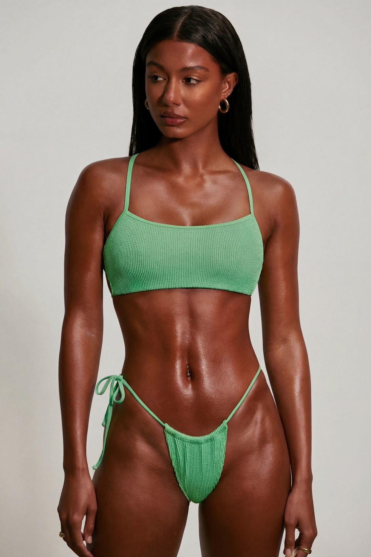 Oh Polly Swim's Kiele wearing the Seersucker Bikini Top in Seafoam Green fabric perfect for poolside lounging