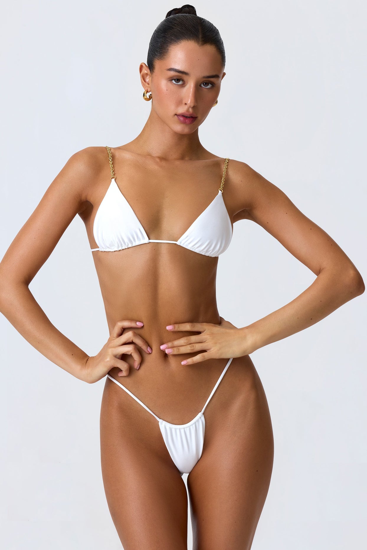 Charmed Ruched Thong Bikini Bottoms in White Oh Polly