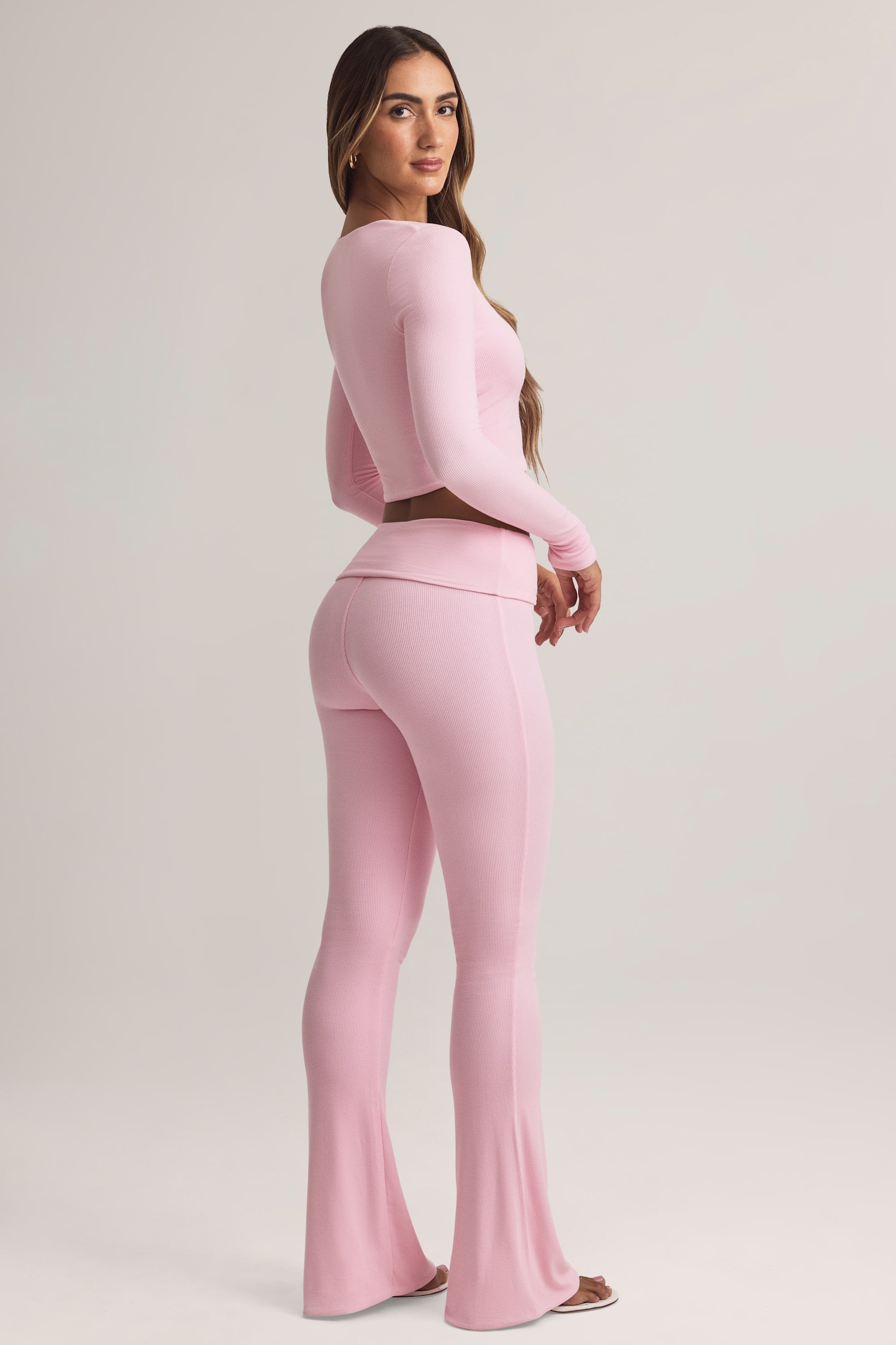 Bebe Modal Foldover Mid-Rise Flared Trousers in Pastel Pink | Oh Polly
