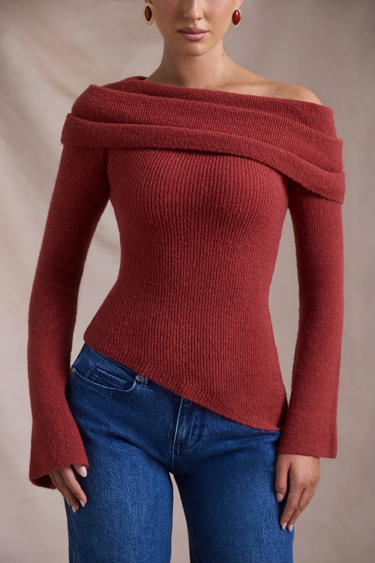 Ribbed-Knit Asymmetric Off-Shoulder Jumper in Brick Red