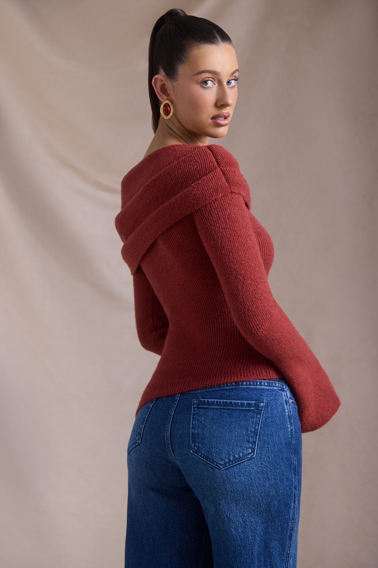 Ribbed-Knit Asymmetric Off-Shoulder Jumper in Brick Red