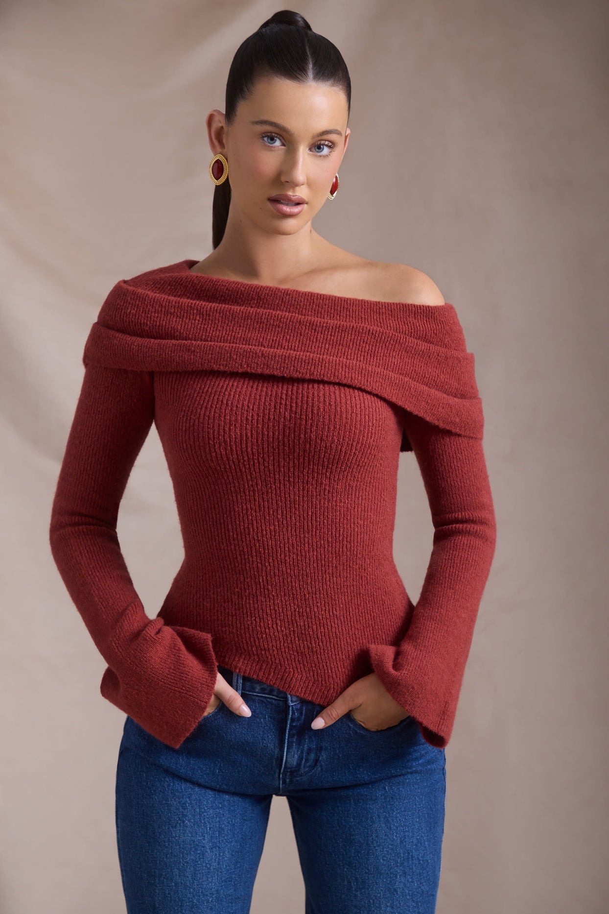 Ribbed-Knit Asymmetric Off-Shoulder Jumper in Brick Red