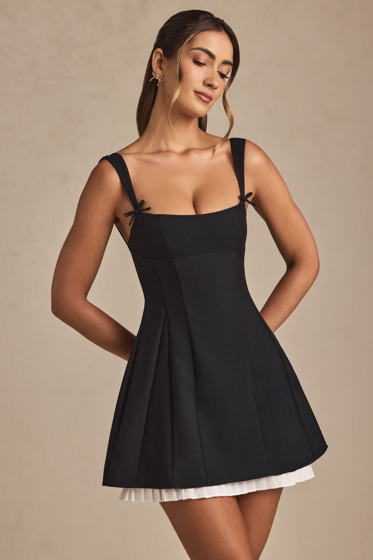 Cressida Bow-Detail Pleated A-Line Mini Dress in Black Oh Polly