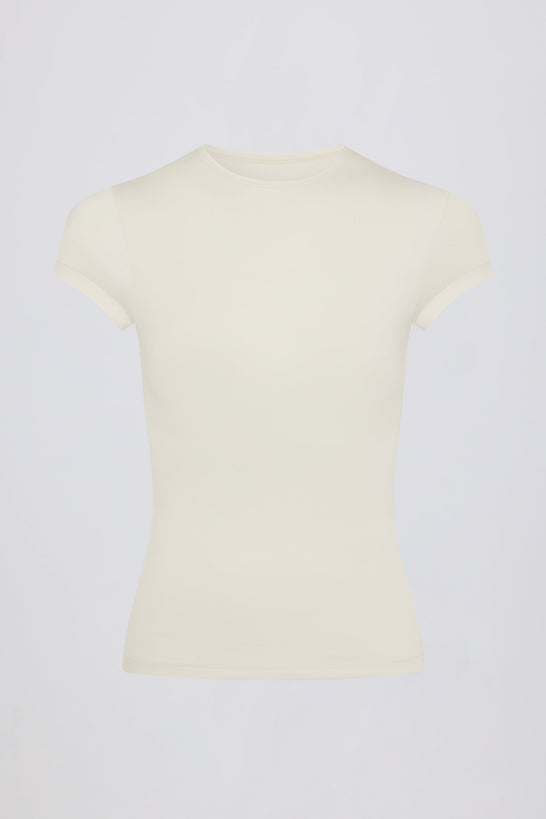 تي شيرت طويل بفتحات باللون الكريمي