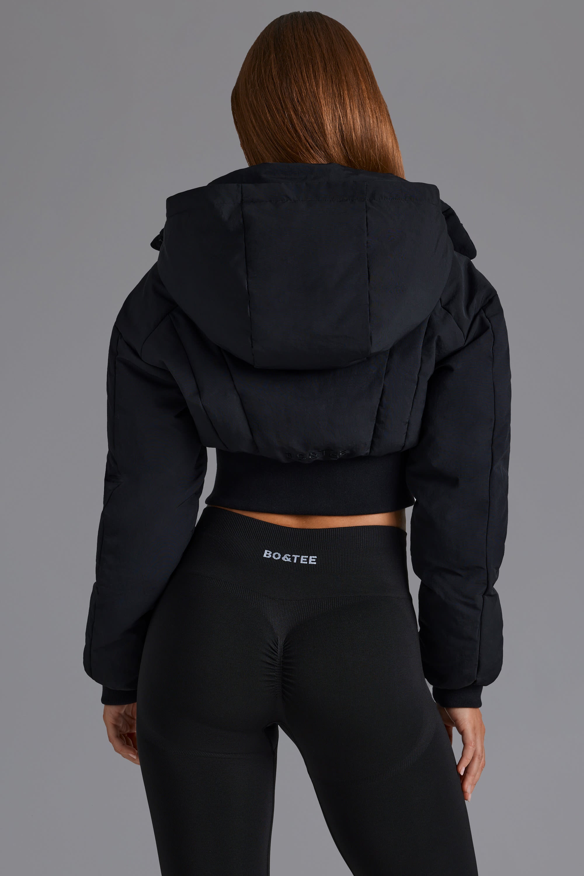 Contour Hooded Cropped Puffer Jacket in Black Oh Polly
