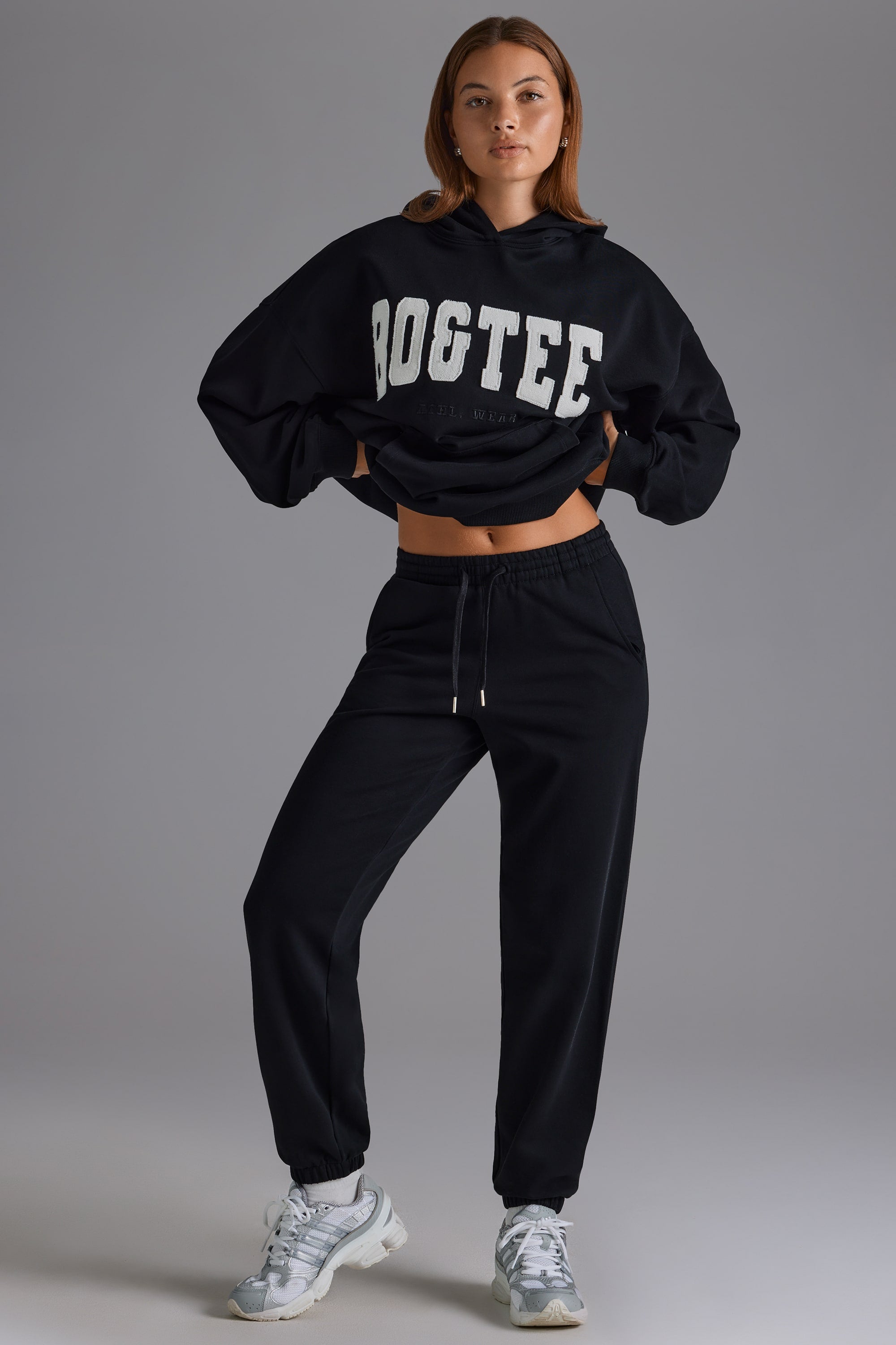 Relaxed Mid Rise Joggers in Black Oh Polly