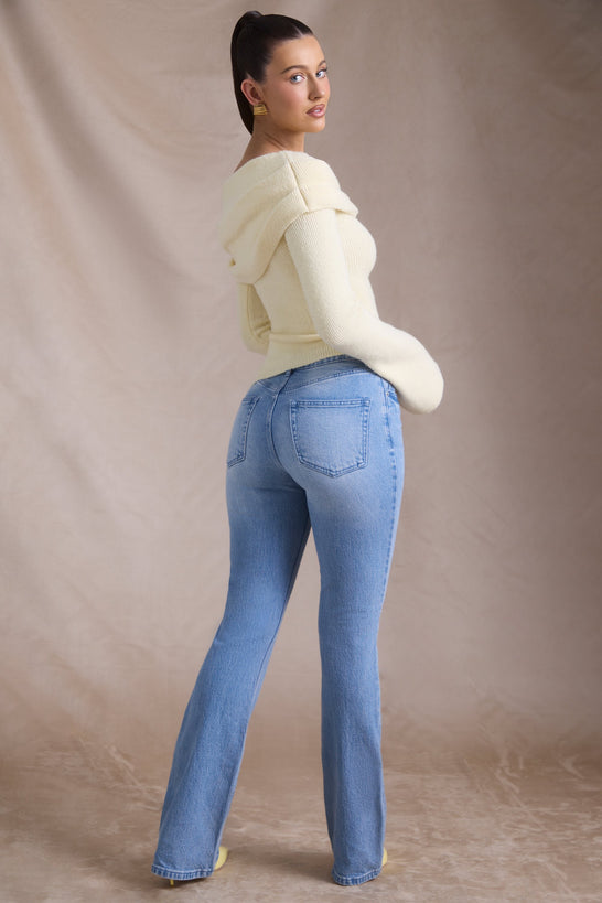 جينز بخصر مرتفع وأرجل واسعة بتغسيلة قديمة