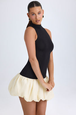 Turtleneck Drop-Waist Bubble Hem Mini Dress in Black