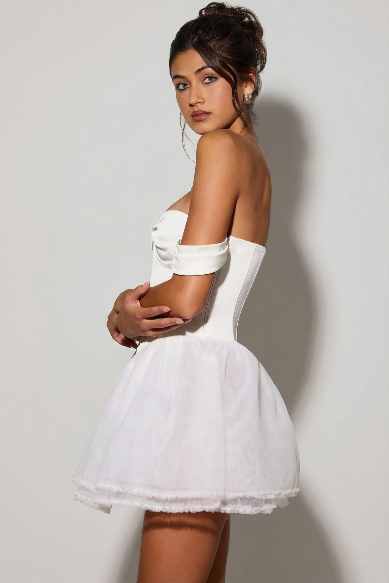 Oh Polly's Meeya wearing the Meredith Mini Dress in White Tulle fabric perfect for engagement celebrations