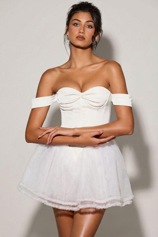 Oh Polly's Meeya wearing the Meredith Mini Dress in White Tulle fabric perfect for rooftop brunches