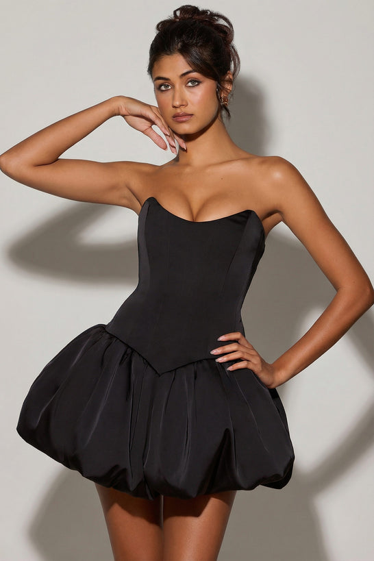 Oh Polly's Meeya wearing the Minerva Mini Dress in Black Satin fabric perfect for cocktail parties