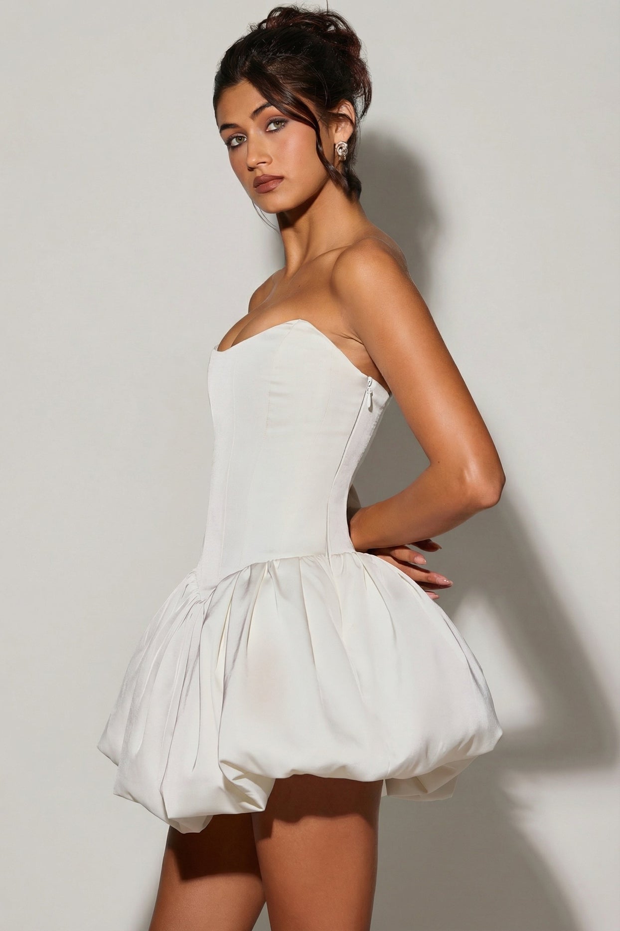 Oh Polly's Meeya wearing the Minerva Mini Dress in White Satin fabric perfect for romantic dinner dates