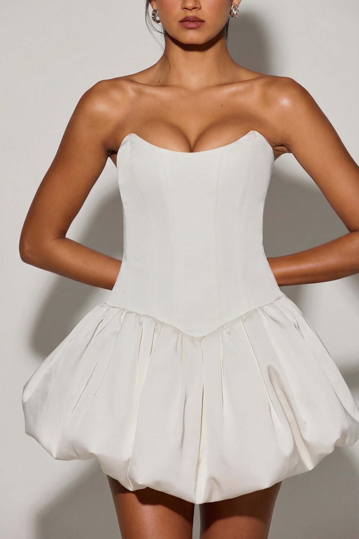 Oh Polly's Meeya wearing the Minerva Mini Dress in White Satin fabric perfect for graduation celebrations