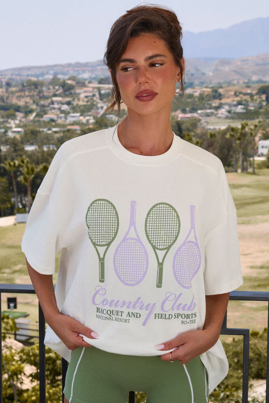 تي شيرت جرافيكي كبير الحجم باللون العاجي