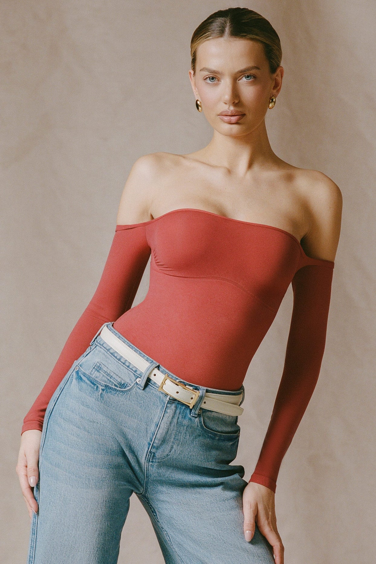 Seamless Off-Shoulder Long-Sleeve Bodysuit in Brick Red