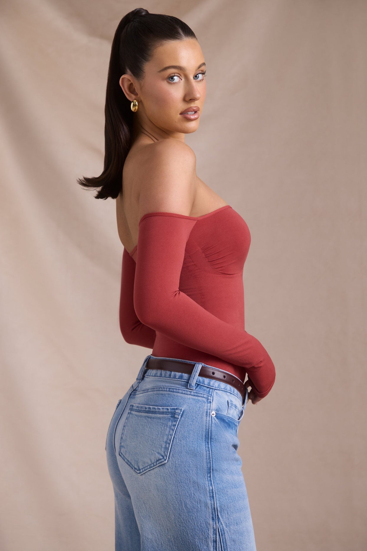 Seamless Off-Shoulder Long-Sleeve Bodysuit in Brick Red