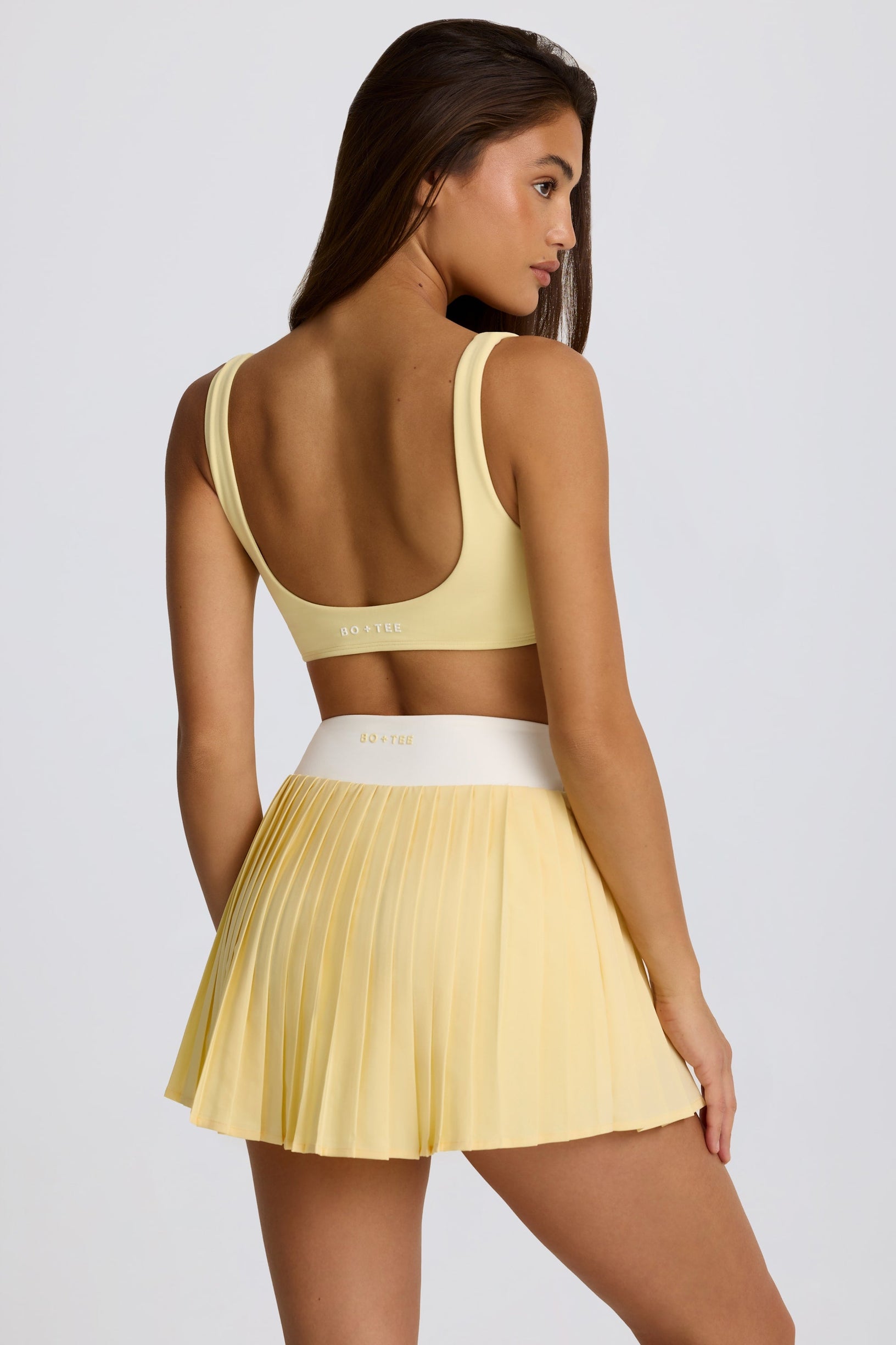 Soft Active Crossover Pleated Mini Skort in Lemon - 1