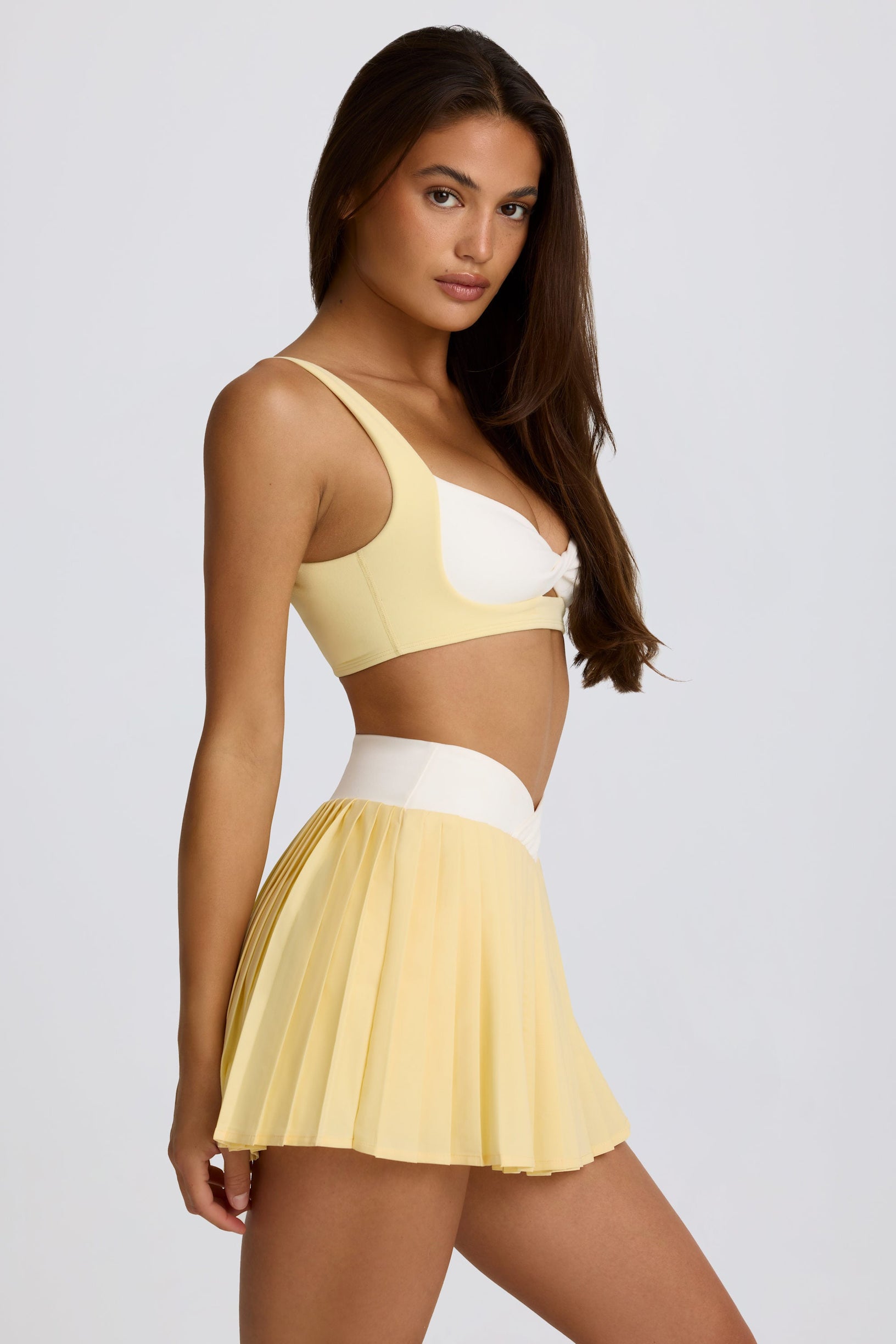 Soft Active Crossover Pleated Mini Skort in Lemon - 2