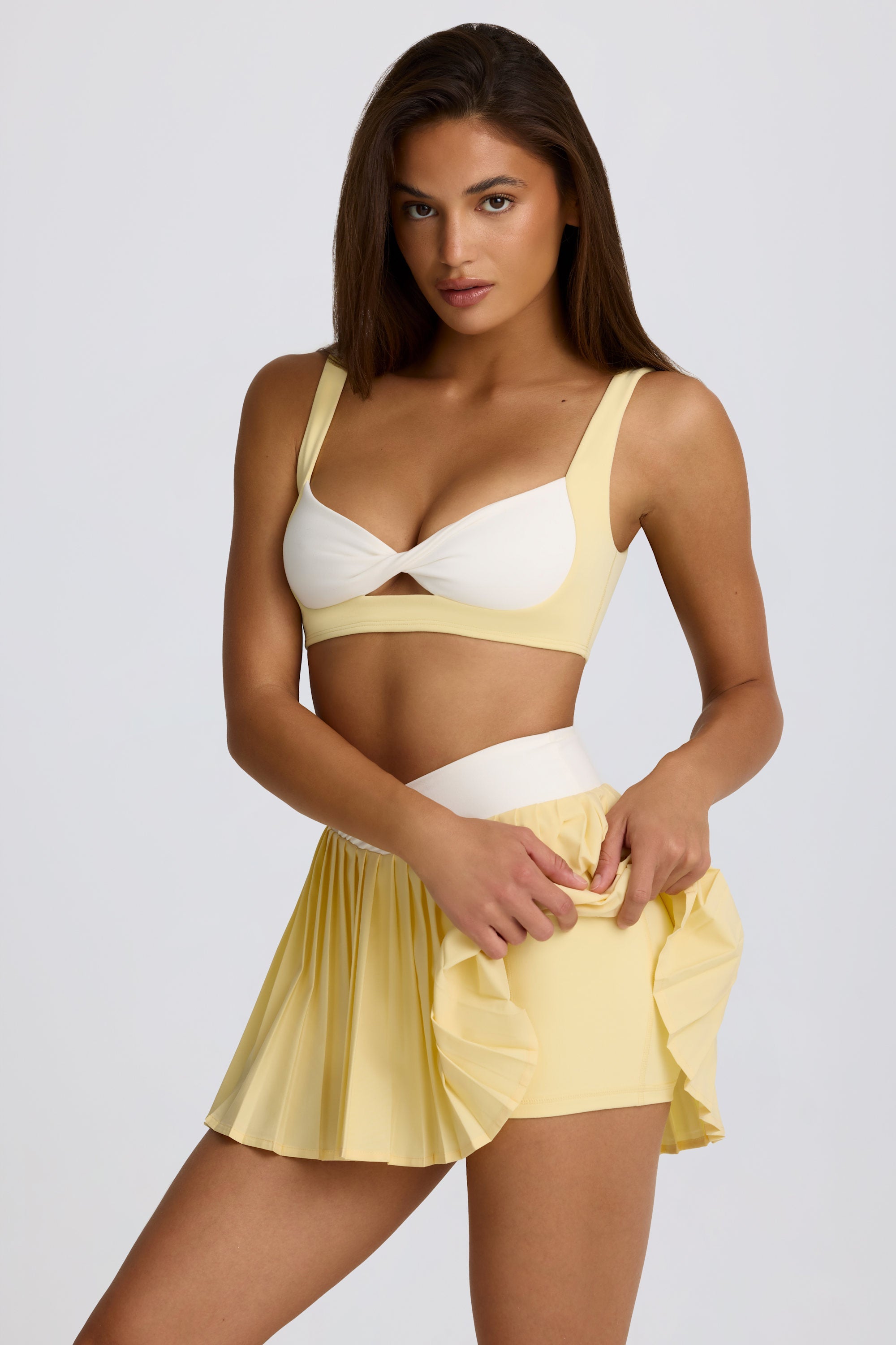 Soft Active Crossover Pleated Mini Skort in Lemon