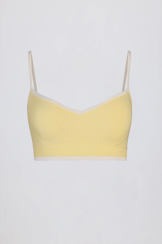 حمالة صدر رياضية ناعمة وفعّالة بفتحة صدر على شكل قلب بلون أصفر ناعم