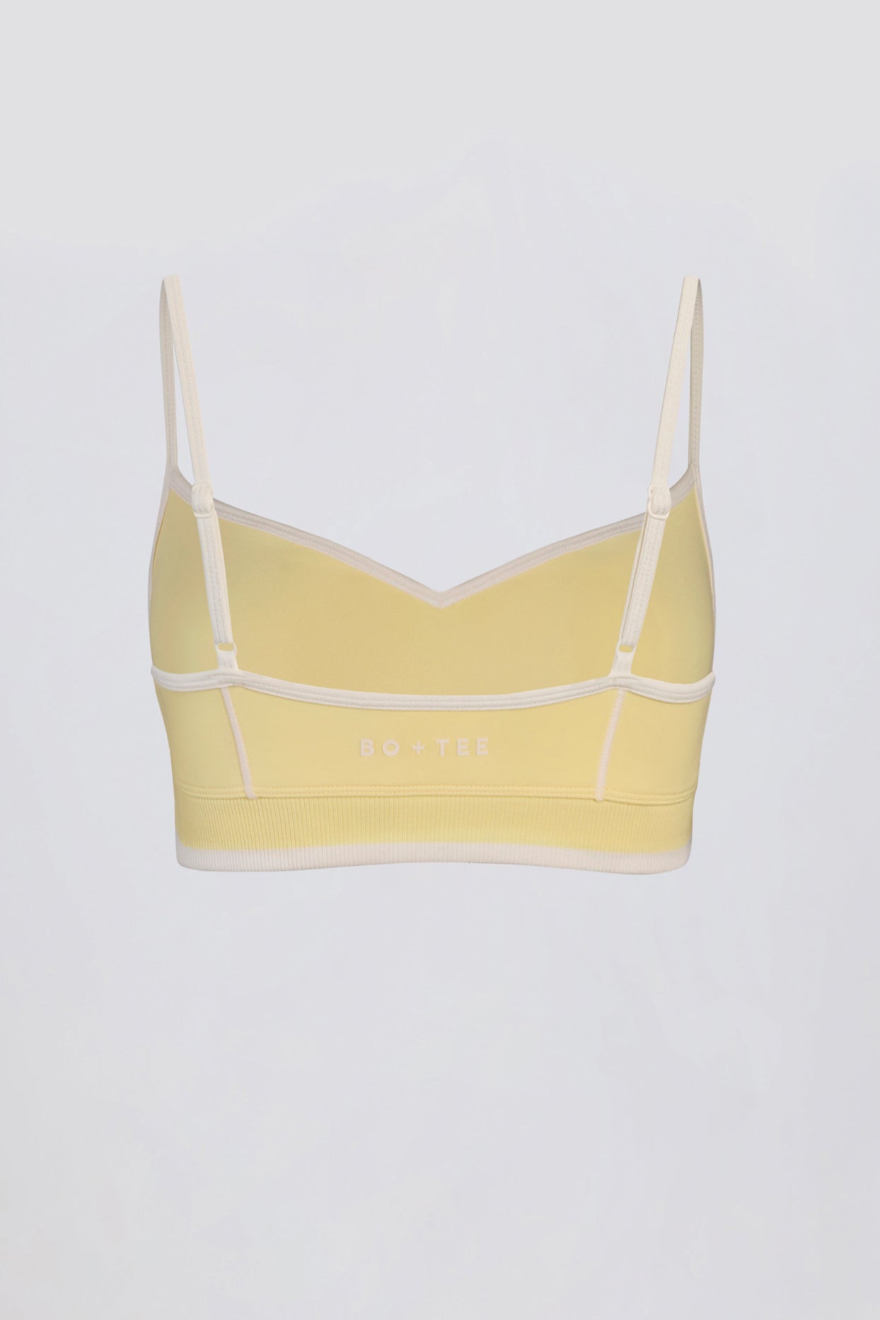 حمالة صدر رياضية ناعمة وفعّالة بفتحة صدر على شكل قلب بلون أصفر ناعم