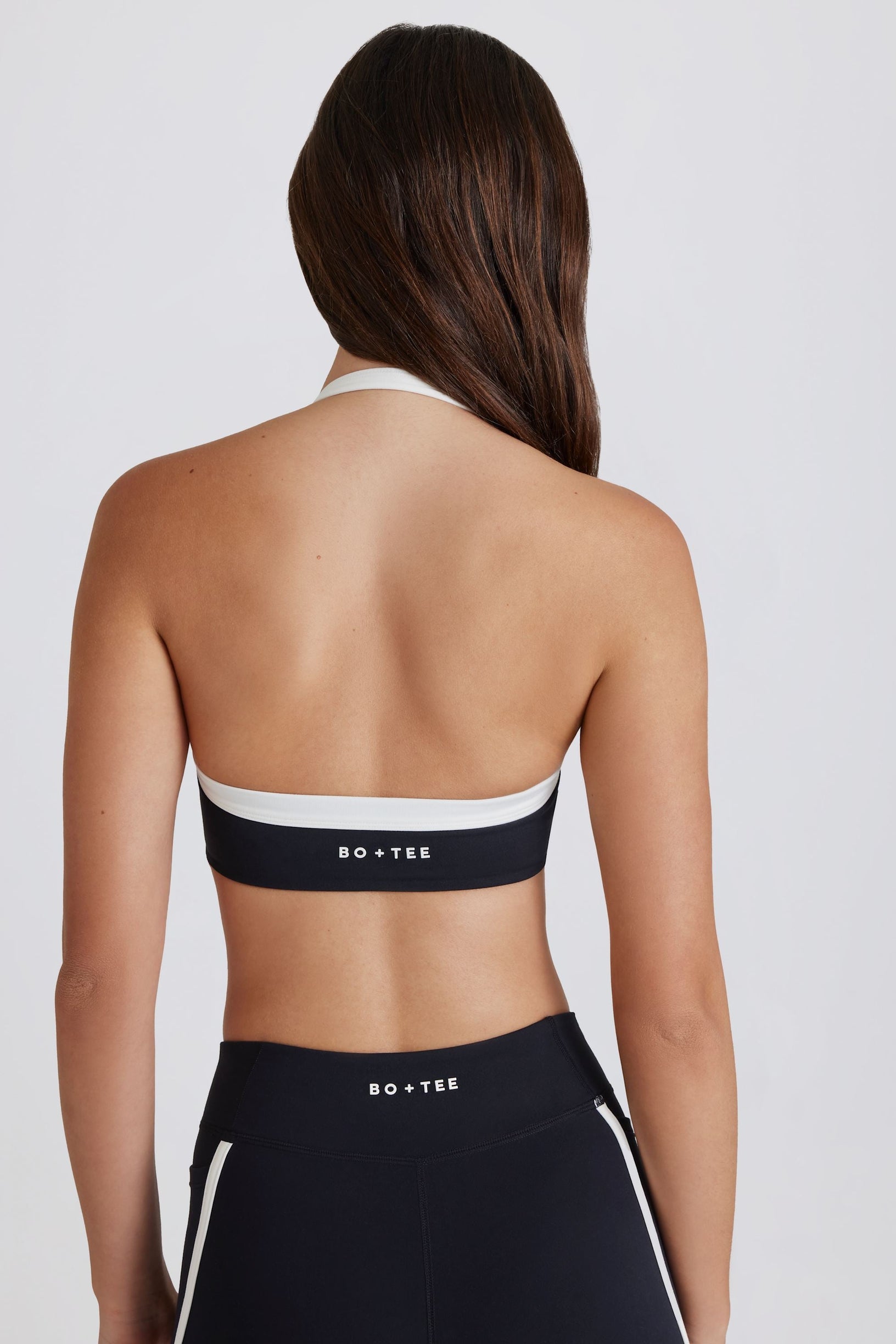 Soft Active Twist-Front Halterneck Sports Bra in Black - 1