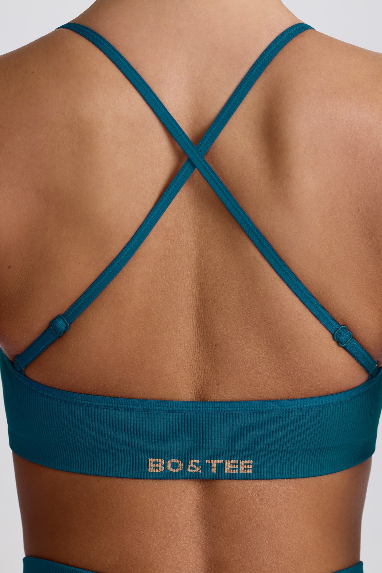 Super Sculpt Seamless Cross-Back Sports Bra in Teal