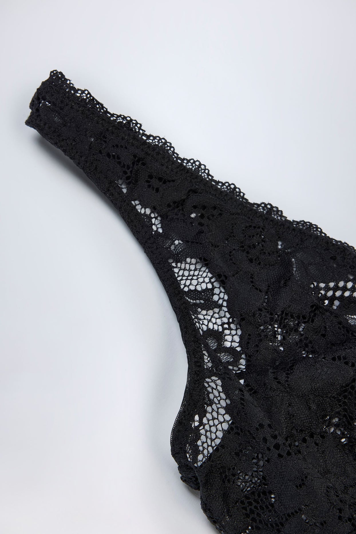 Plunge-Neck Lace Bodysuit in Black